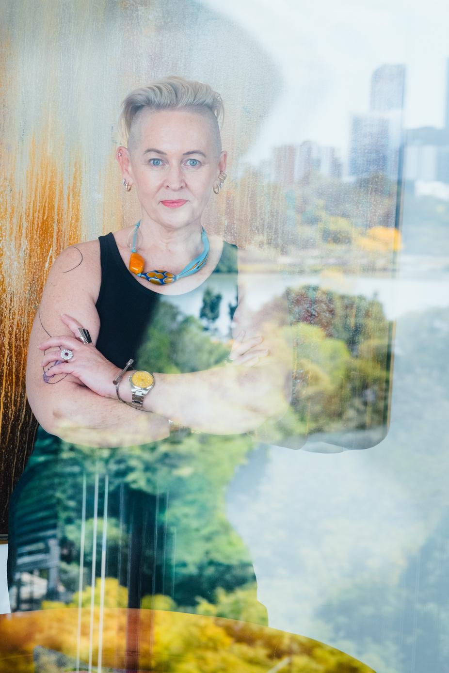 Artist portrait photographed through reflections in glass